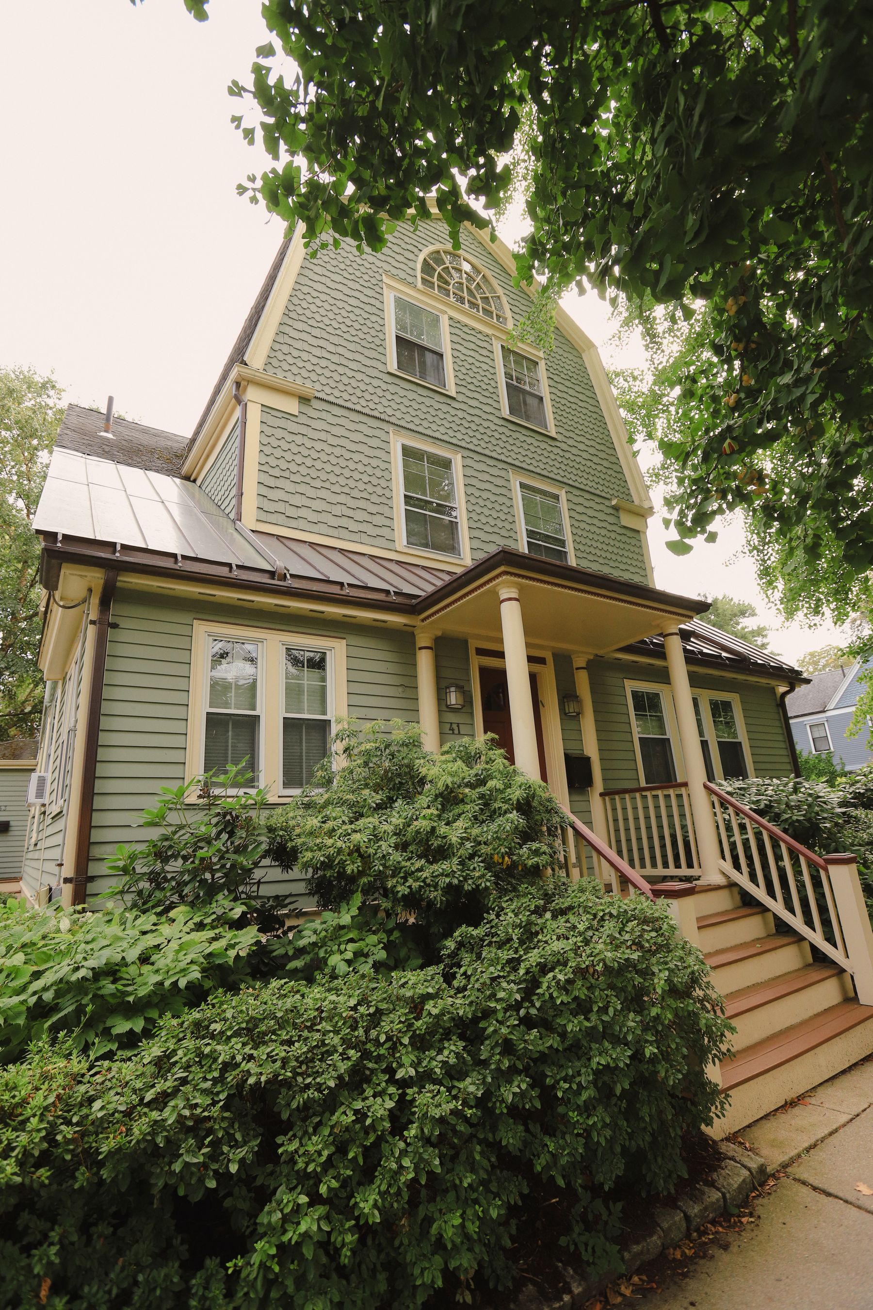 American home with painted siding and landscaped grounds